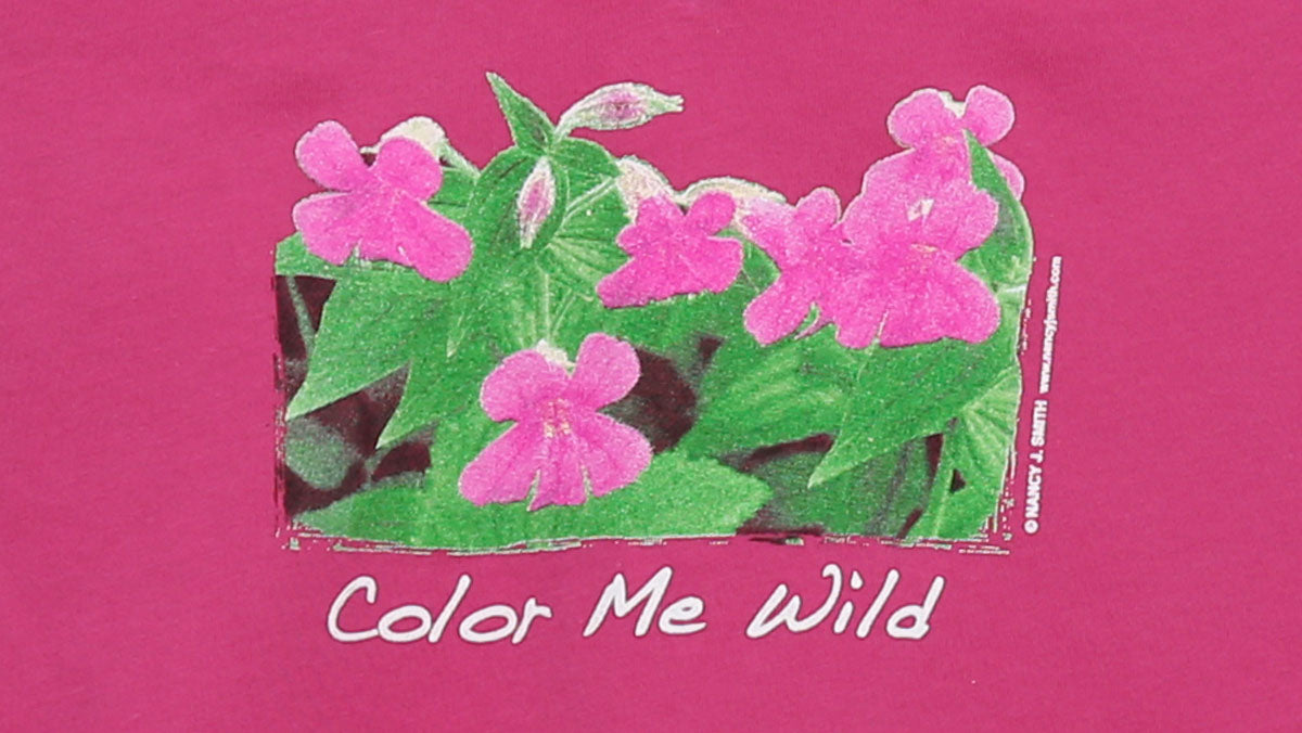 Detail view of shirt screen print featuring Monkey Flower and caption "Color Me Wild".