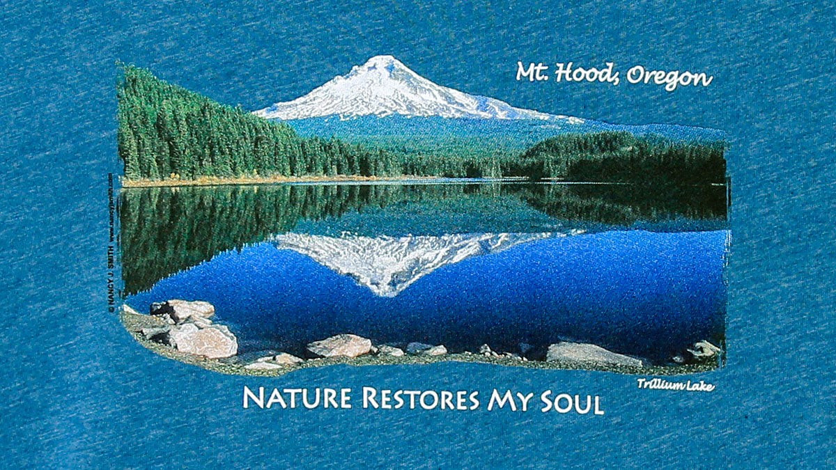 Detail view of shirt screen print on heather teal featuring Oregon's Mt. Hood over Trillium Lake with caption "Nature Restores My Soul".