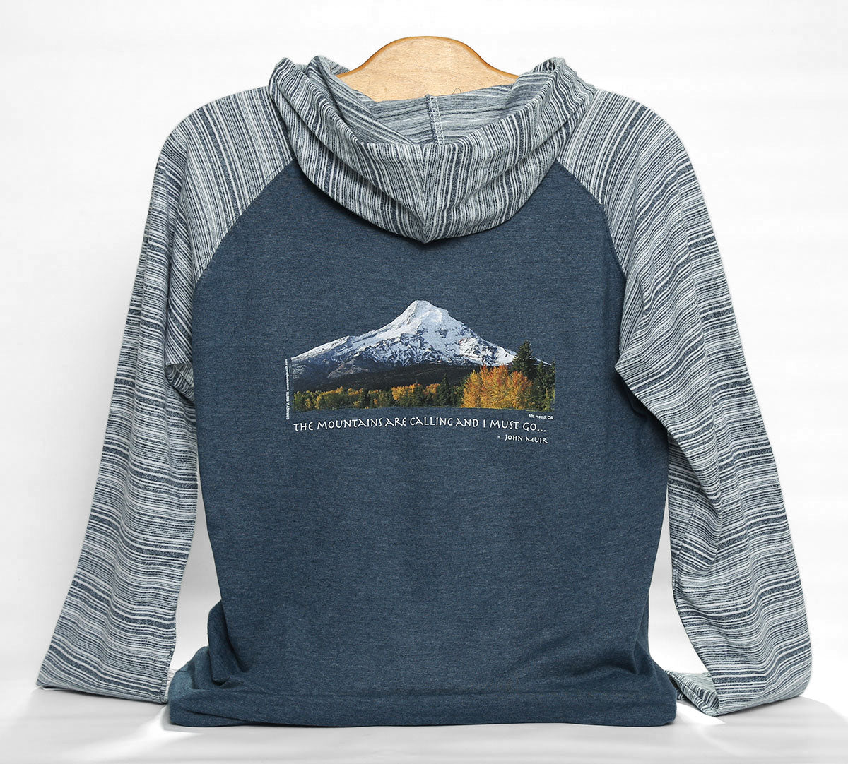 Back view of Mt Hood/Fall unisex hoodie in color heather navy/stripe. Features Oregon's Mt Hood and fall trees with caption "The Mountains are Calling and I Must Go..."