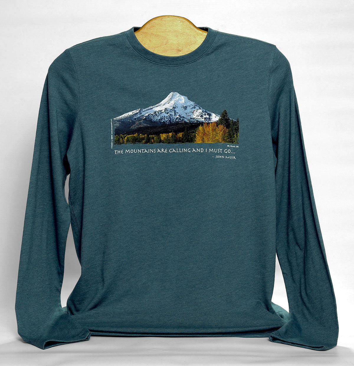 Front view of Mt Hood/Fall long-sleeve shirt in color heather slate grey. Features Oregon's Mt Hood and fall trees with caption "The Mountains are Calling and I Must Go..."