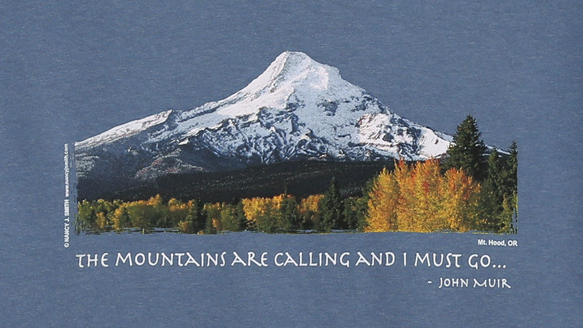 Detail view of shirt screen print, featuring Oregon's Mt. Hood and fall trees. Caption reads "The Mountains are Calling and I Must Go...".
