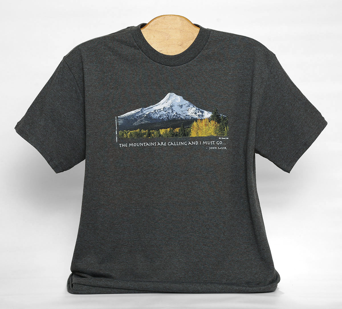 Front view of Mt Hood/fall t-shirt short-sleeve in color tweed dark grey. Features Oregon's Mt Hood and fall trees with caption "The Mountains are Calling and I Must Go..."